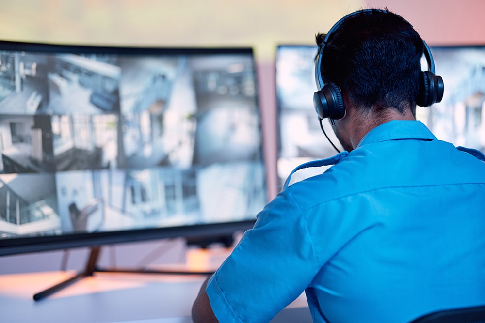 Security guard, headphones and cctv monitor, communication and i